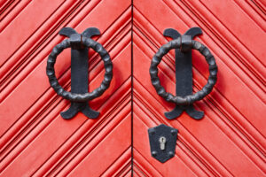 antique-metallic-door-knob-on-a-red-wooden-doors-2022-02-02-05-05-23-utc (1)